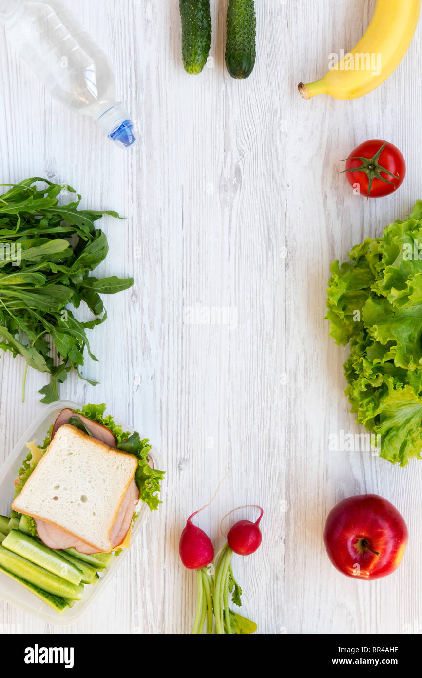 Lunch box and set of ingredients for making school lunch: vegetables ...