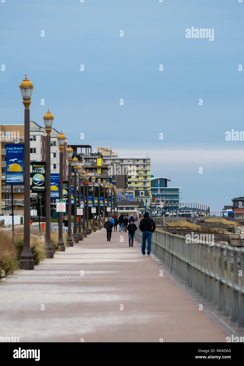 Long Branch, United States - November 18 2018: Pedestrians walk along New  Jersey shore on the boardwalk alongside Ocean Avenue Stock Photo - Alamy