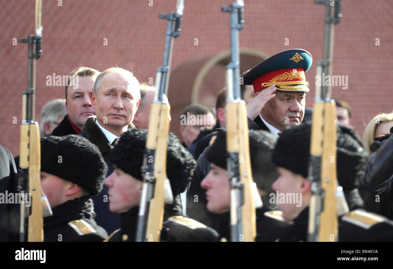 Moscow, Russia. 23rd Feb, 2019. Russian President Vladimir Putin and Defence Minister Sergei Shoigu, right, attend a wreath ceremony at the Tomb of the Unknown Soldier at the Kremlin Wall to honour the memory of fallen soldiers on Defender of the Fatherland Day February 23, 2019 in Moscow, Russia. Credit: Planetpix/Alamy Live News Stock Photo