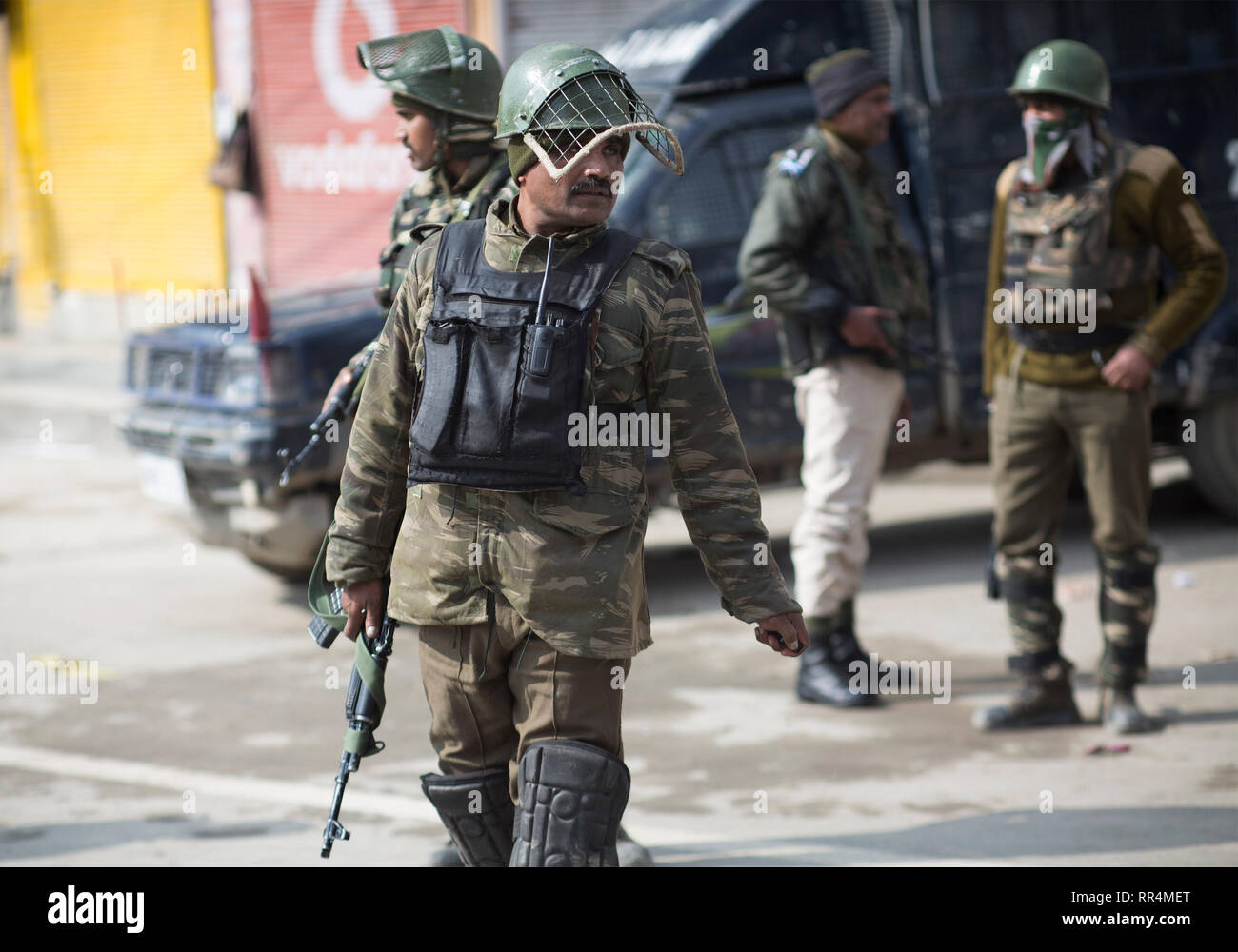 (190224) -- SRINAGAR, Feb. 24, 2019 (Xinhua) -- Indian paramilitary troopers stand guard during a security lockdown in downtown area of Srinagar, the summer capital of Indian-controlled Kashmir, Feb. 24, 2019. Indian-controlled Kashmir Sunday observed a shutdown to protest arrests of political activists and move of legally abrogating a law - Article 35 A of Indian constitution - that confers special status to the region. The strike call was given by the region's separatist groups under the leadership Joint Resistance Leadership (JRL) condemning arrests and fearing tampering with Article 35 A w Stock Photo