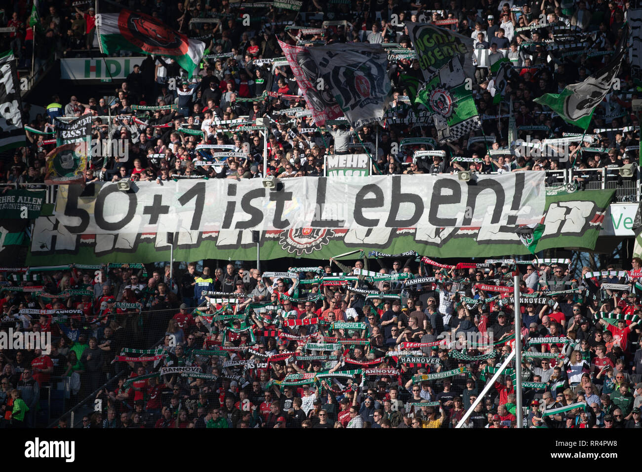 Hannover, Germany. 24th Feb, 2019. Soccer: Bundesliga, Hannover 96 - Eintracht Frankfurt, 23rd matchday in the HDI-Arena. Hanover's fans show a poster with the inscription '50 1 is life! Credit: Swen Pförtner/dpa - IMPORTANT NOTE: In accordance with the requirements of the DFL Deutsche Fußball Liga or the DFB Deutscher Fußball-Bund, it is prohibited to use or have used photographs taken in the stadium and/or the match in the form of sequence images and/or video-like photo sequences./dpa/Alamy Live News Stock Photo