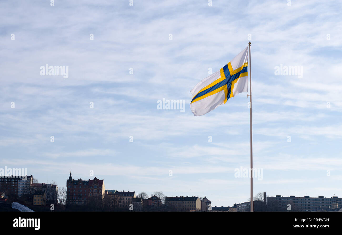 Stockholm, Sweden, 24th Feb 2019. February 24 celebrates the 'Sverigefinnarnas'day in Stockholm and around Sweden. The purpose of the day is to make the Swedish-Finnish minority visible and spread information about their history, language and culture.Here is a picture from Stockholm City Hall that flags with the Sweden-finnish flag in honor of the day. Credit: Jari Juntunen/Alamy Live News Stock Photo