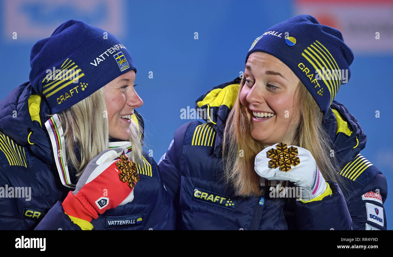 Seefeld, Austria. 24th Feb, 2019. Cross Country, World Championship, Team Sprint classic, Women. Maja Dahlqvist (l) and Stina Nilsson from Sweden are happy about their gold medals. Credit: Hendrik Schmidt/dpa-Zentralbild/dpa/Alamy Live News Stock Photo