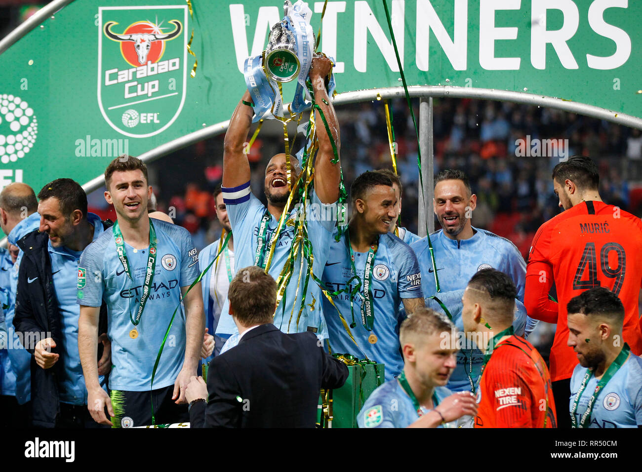 London, UK. 24th Feb, 2019. Vincent Kompany of Manchester City lifts the trophy during the EFL Carabao Cup Final between Chelsea and Manchester City at Wembley Stadium, London, England on 24 February 2019. Photo by Carlton Myrie. Editorial use only, license required for commercial use. No use in betting, games or a single club/league/player publications. Credit: UK Sports Pics Ltd/Alamy Live News Stock Photo