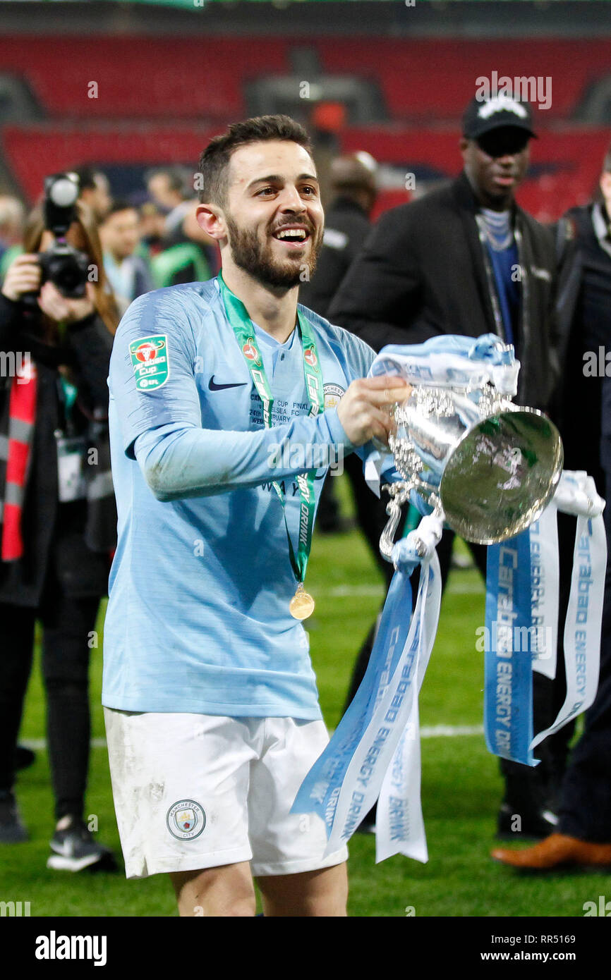 London, UK. 24th Feb, 2019. Bernardo Silva of Manchester City celebrates with the trophy during the EFL Carabao Cup Final between Chelsea and Manchester City at Wembley Stadium, London, England on 24 February 2019. Photo by Carlton Myrie. Editorial use only, license required for commercial use. No use in betting, games or a single club/league/player publications. Credit: UK Sports Pics Ltd/Alamy Live News Stock Photo