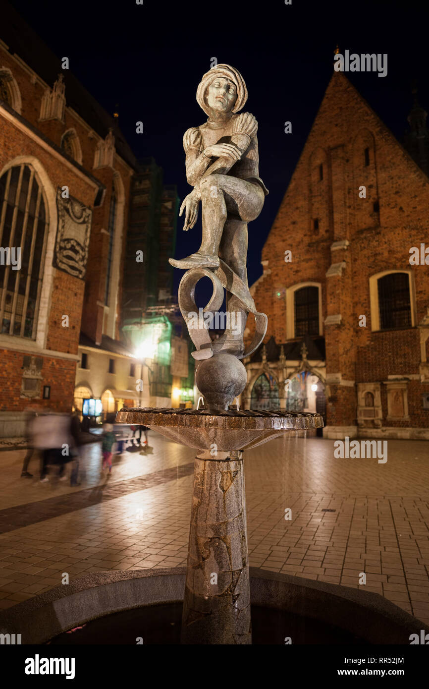 Poland, city of Krakow, Student statue at night, Zak Fountain on Mariacki Square in Old Town, copy of one of the sculptures from St Mary's Church made Stock Photo