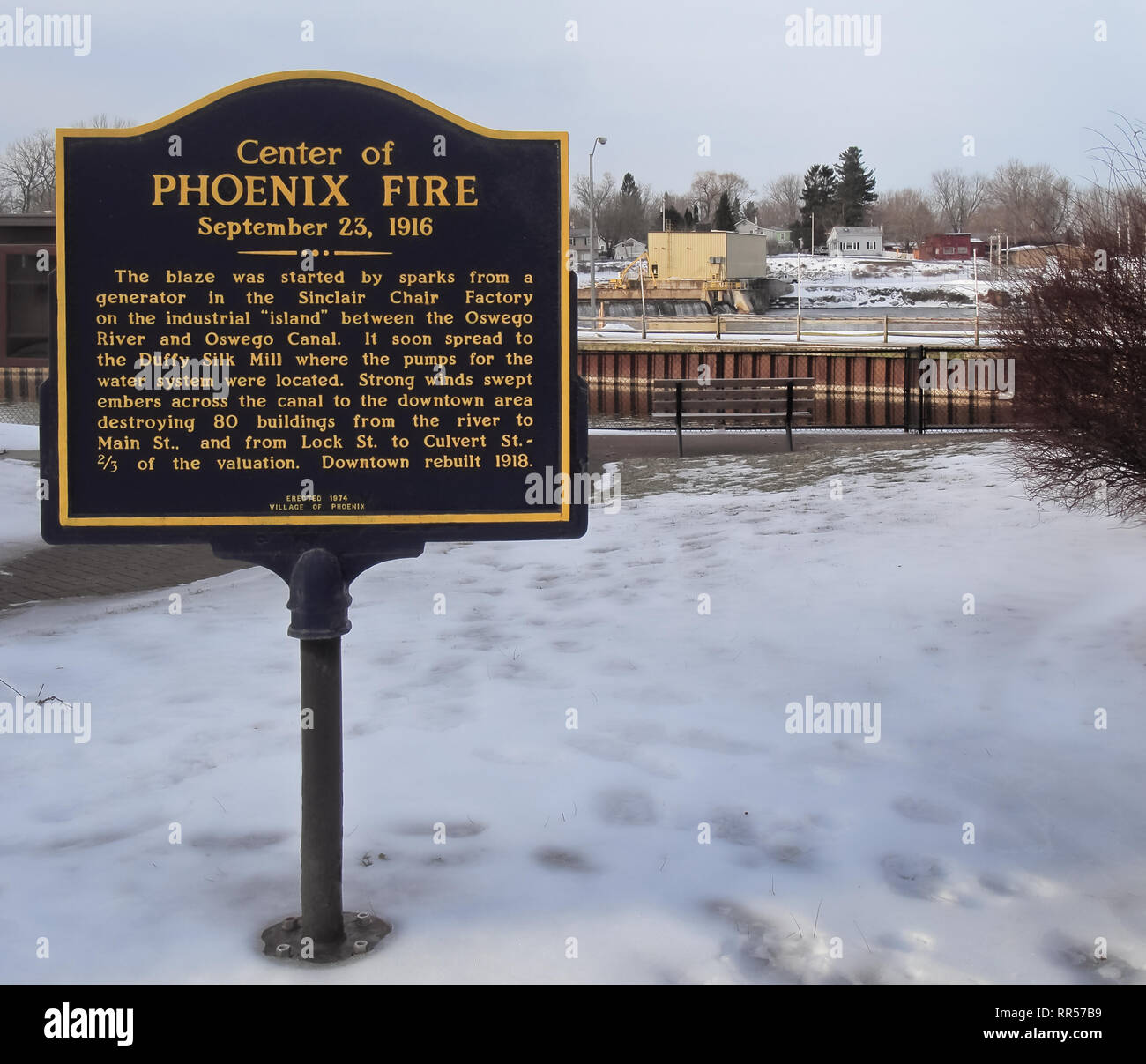 Phoenix, New York, USA. February 23, 2019. Memorial plaque in the small town center of Phoenix, New York, on the Oswego River, commemorating a disaste Stock Photo