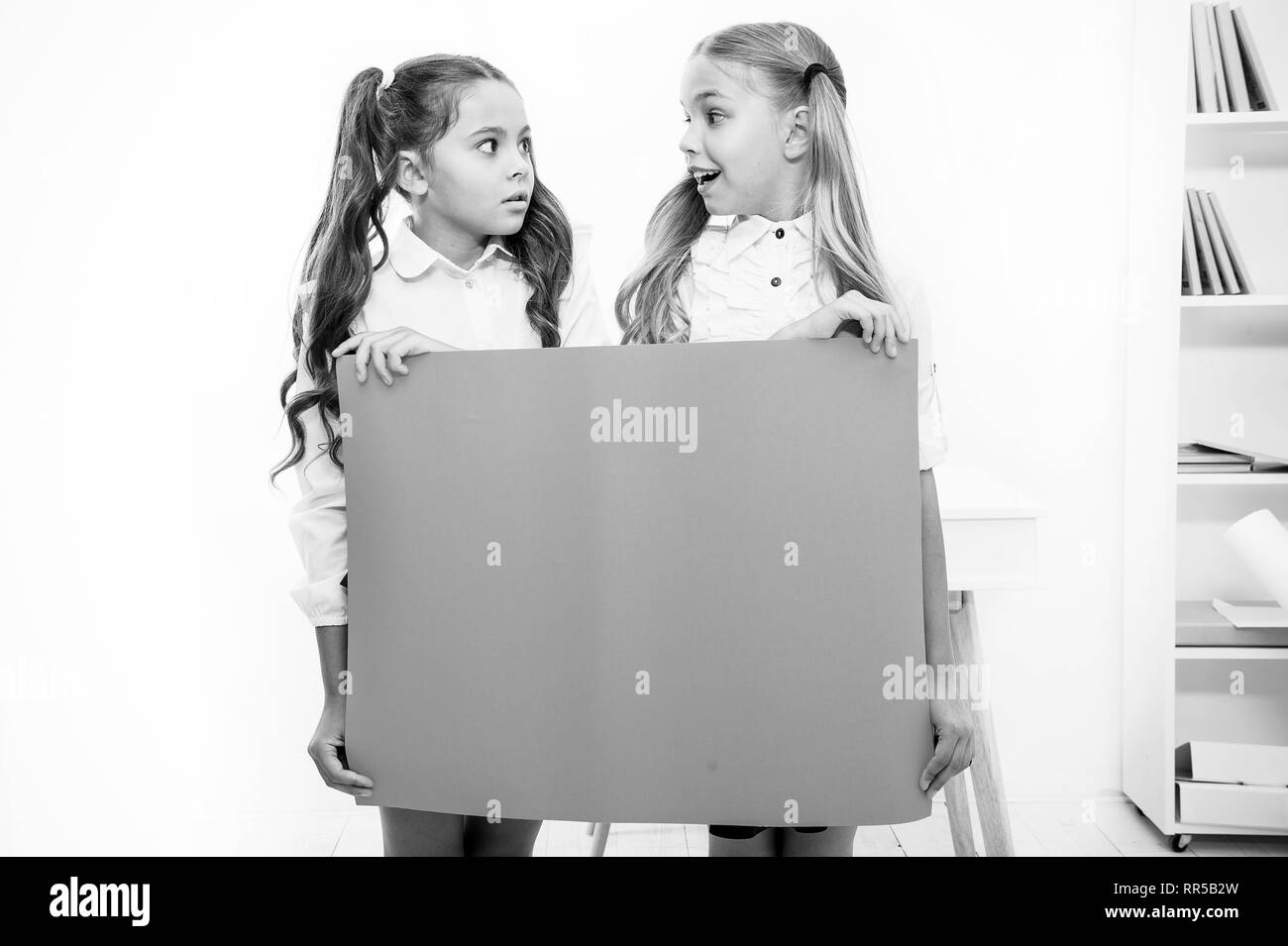 The Surprising News About Childrens >> School Announcement Concept Surprising News Girls Hold The Surprising News About Childrens >> School Announcement Concept Surprising News Girls Hold