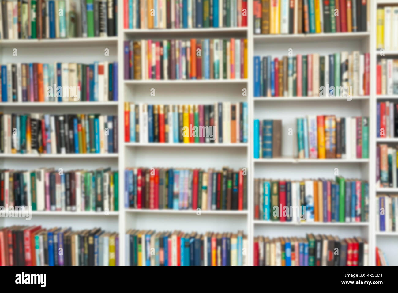 Blurred Image Of Colorful Bookshelf In Secondhand Shop Stock Photo Alamy