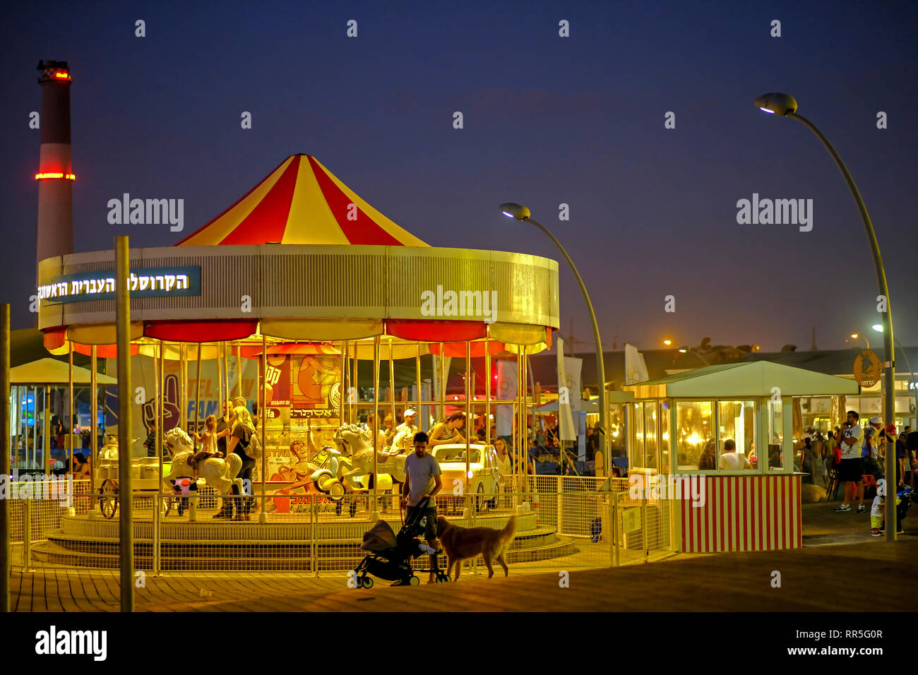 A carousel at night. Photographed at the old Tel Aviv Port, Israel Stock Photo