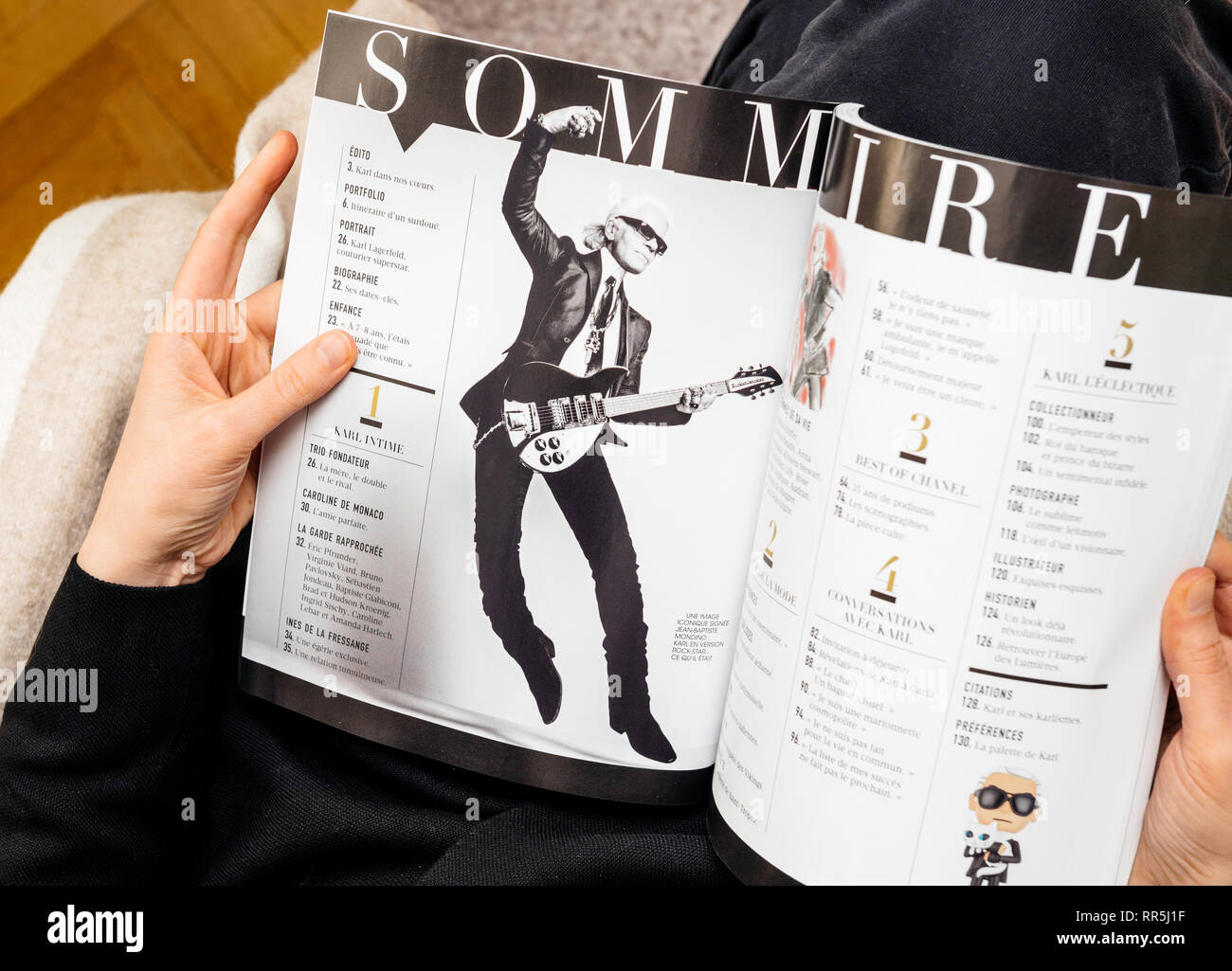 Paris France Feb 23 19 Woman Reading French Magazine Covering Karl Lagerfeld Death Iconic Fashion Designer Died Aged 85 Summary With Karl Playing Electric Guitar Stock Photo Alamy