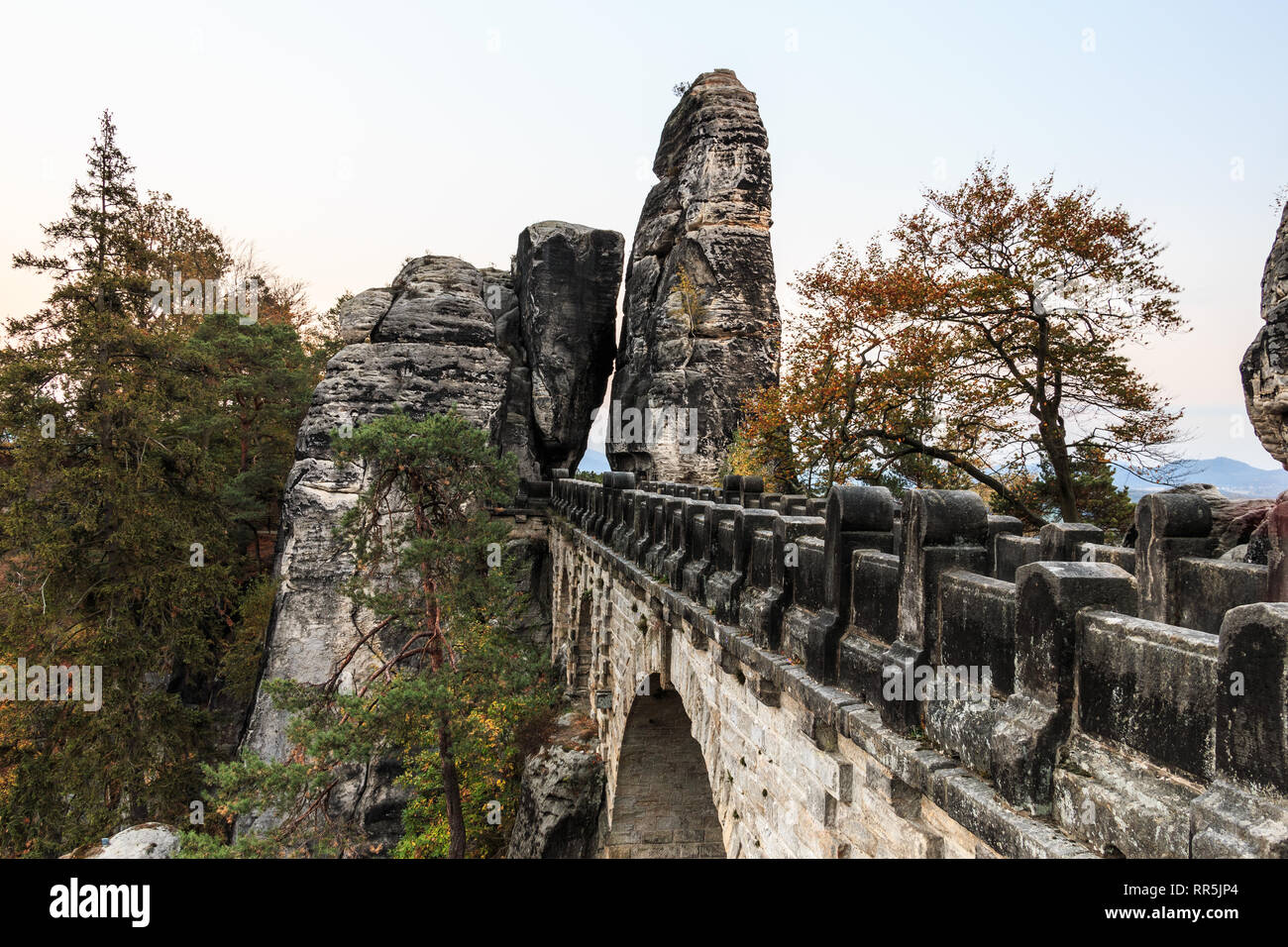Bastei bridge national park Saxon Switzerland in Elbe Sandstone Mountains in side view. Rock formation with the rocky gate in autumn with trees Stock Photo