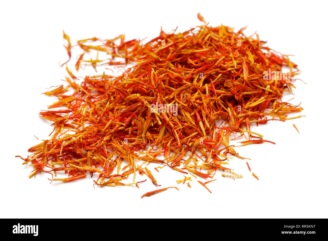 Heap of dry saffron spice isolated on white background Stock Photo