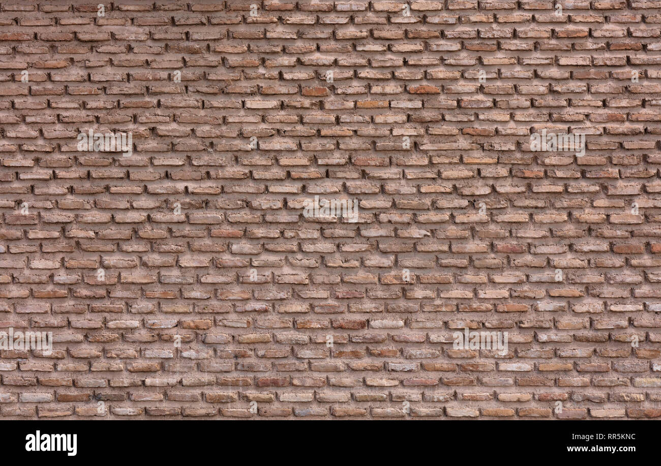 red adobe bricks wall background, Murcia cathedral in Spain Stock Photo