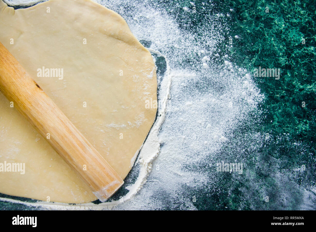 Dough for ravioli, dumplings, pizza, noodles, spaghetti, on a floured