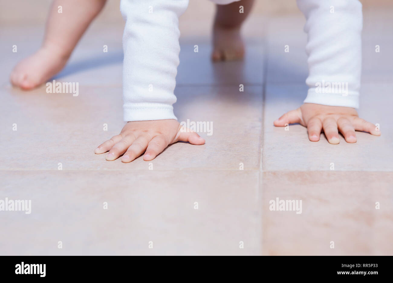 Baby boy practice crawling for the first time. Baby milestone concept