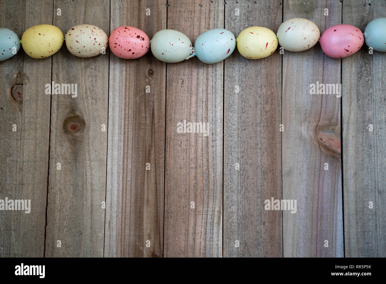 Flat lay speckled easter egg spring concept on a wood background Stock Photo