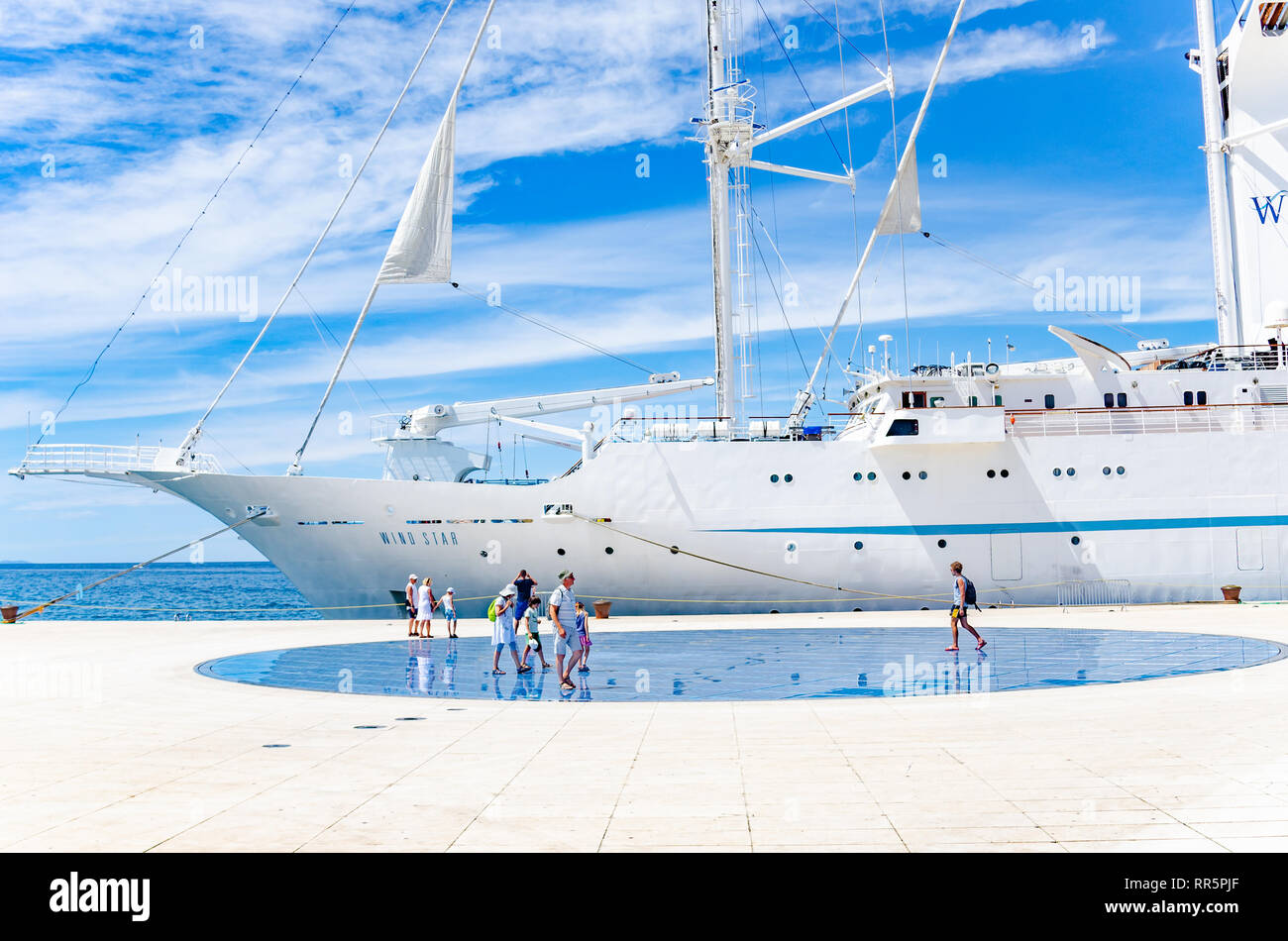 A large cruise sailing ship in the port on the embankment of the city of Zadar. Stock Photo