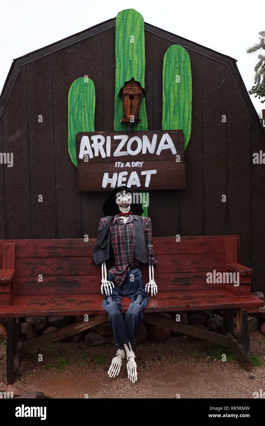 A skeleton outside of a general store in the Arizona desert warns tourists about the summer heat
