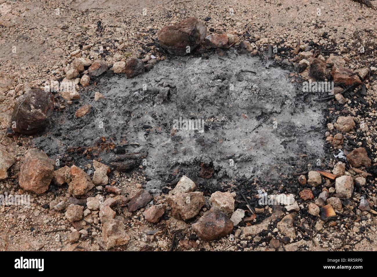 The Remnants Of A Fire Pit Left In The Arizona Desert Stock Photo