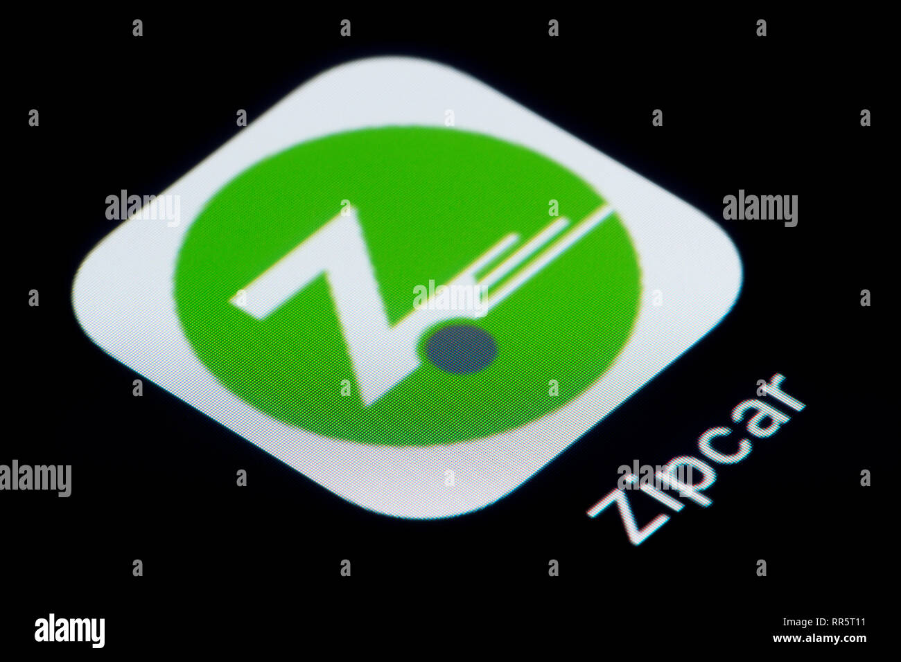 A close-up shot of the Zipcar app icon, as seen on the screen of a smart phone (Editorial use only) Stock Photo
