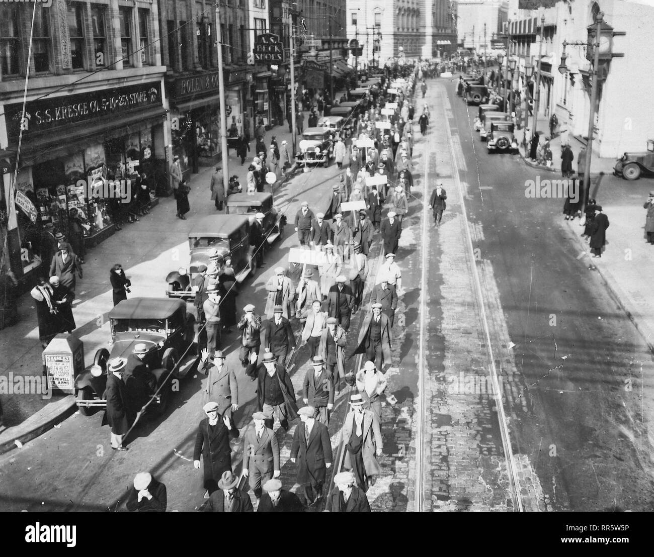 Depression - Unemployed - the Unemployed Union: marchers south on Broadway: Camden New Jersey typical scene reflecting large population of unemployed in desperate need of work and looking for jobs. 1935 Stock Photo