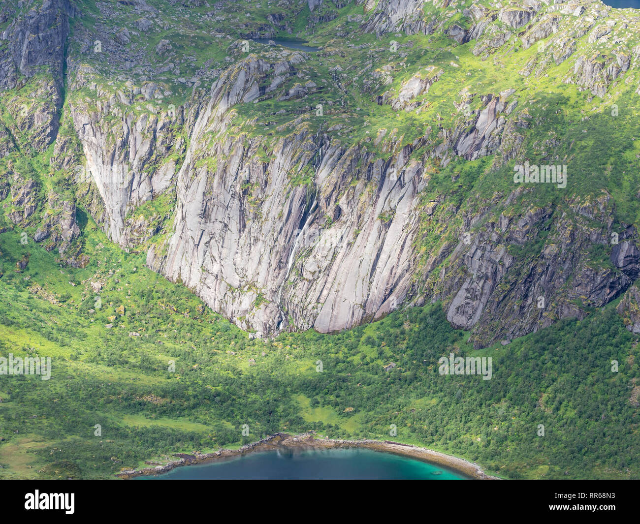 View from mountain range above village Raften down to shore at the Raftsund, the strait between islands  Hinnøya and Austvågøya, rock formations on th Stock Photo