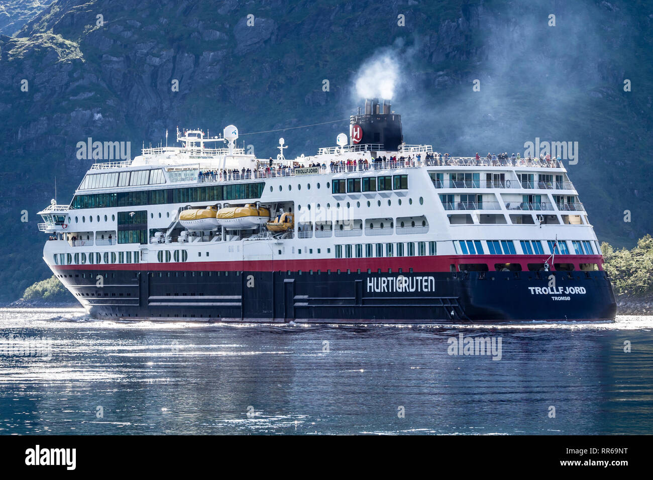 Hurtigruten cruise ship 'Trollfjord' passing the Raftsund, the strait between islands  Hinnøya and Austvågøya, surrounded by steep mountains, Norway Stock Photo