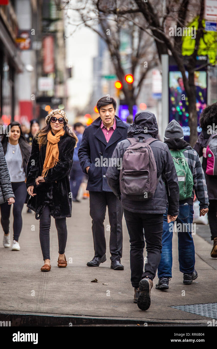 NEW YORK CITY - DECEMBER 14, 2018: Winter street scene in New York City Manhattan with real people in everyday situation on busy urban street Stock Photo