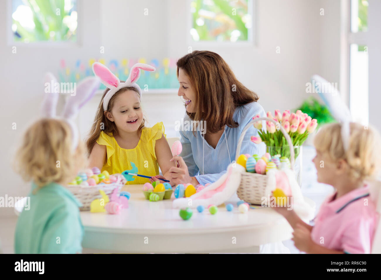Mother And Kids Color Easter Eggs Mom Little Girl And Boy With