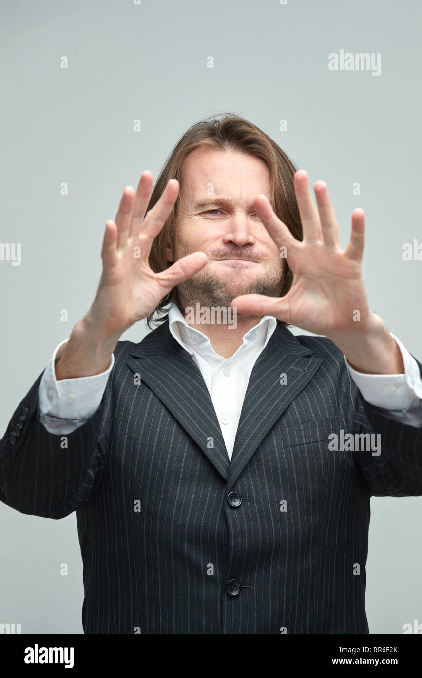 The Handsome Men In Black Suits On A White Background A White