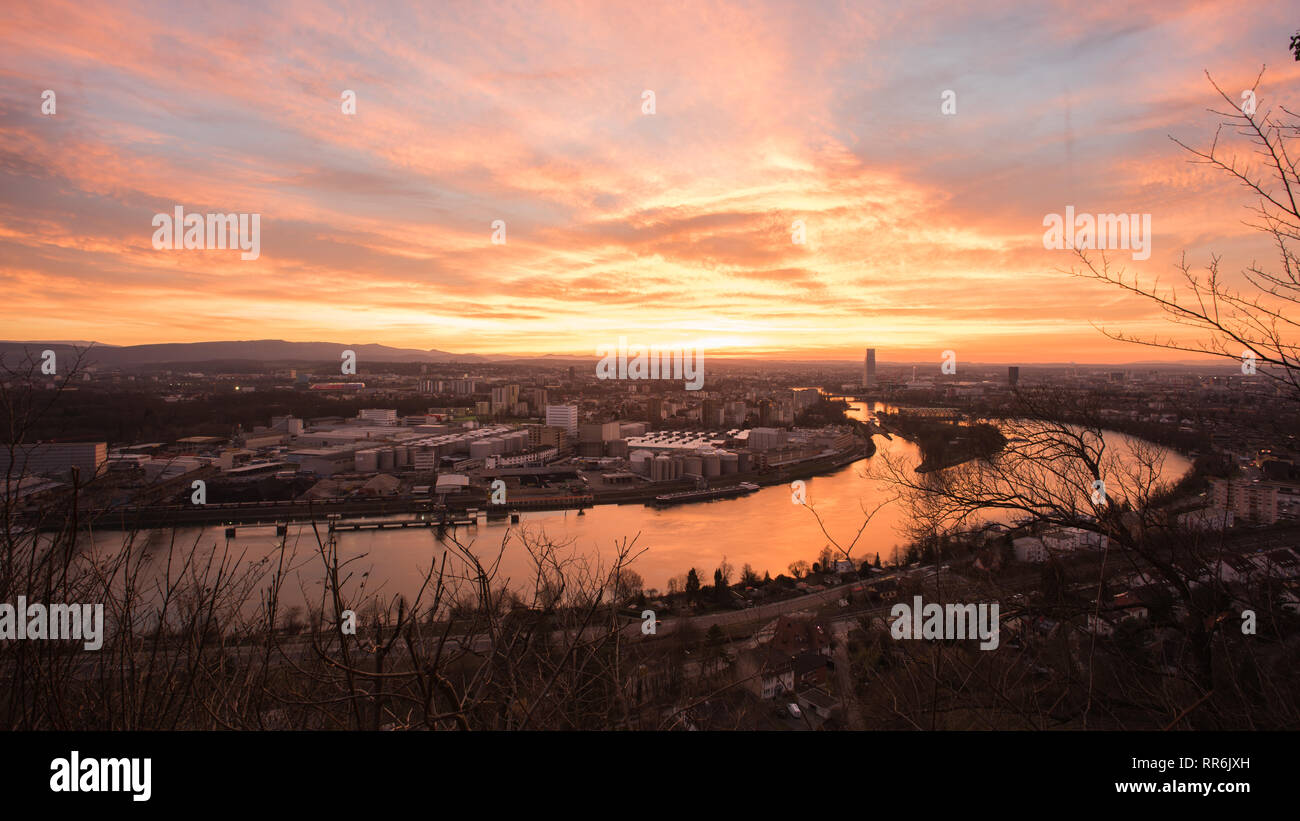 Basel Switzerland in the evening with a beautiful sunset, photographed by the Hornfelsen in neighboring Germany Stock Photo