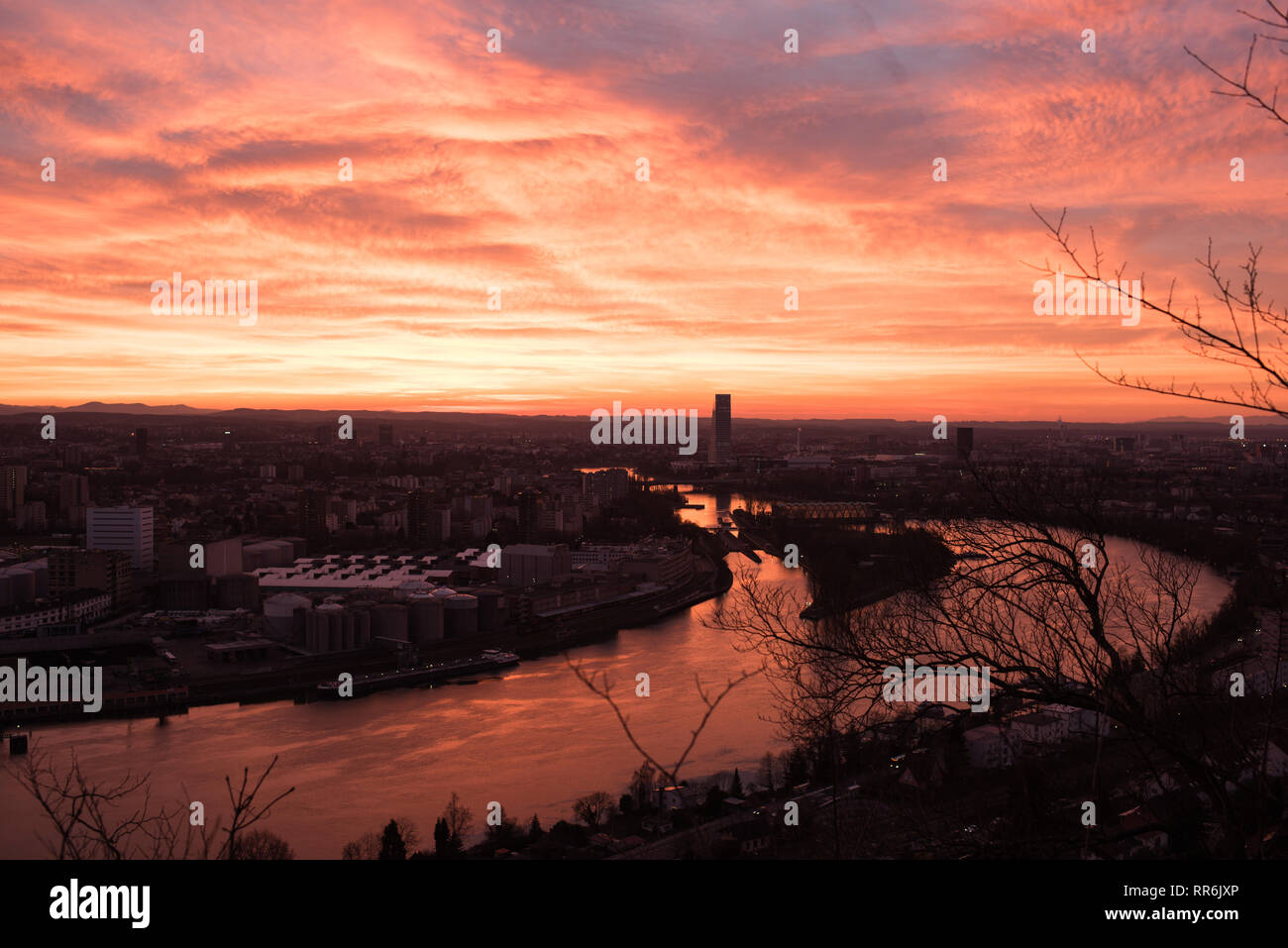 Basel Switzerland in the evening with a beautiful sunset, photographed by the Hornfelsen in neighboring Germany Stock Photo