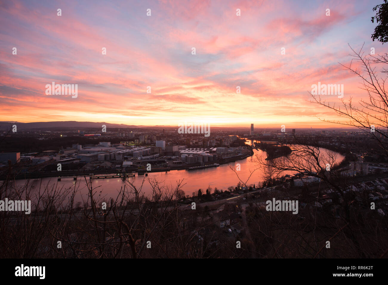 Basel Switzerland in the evening with a beautiful sunset, photographed by the Hornfelsen in neighboring Germany Stock Photo