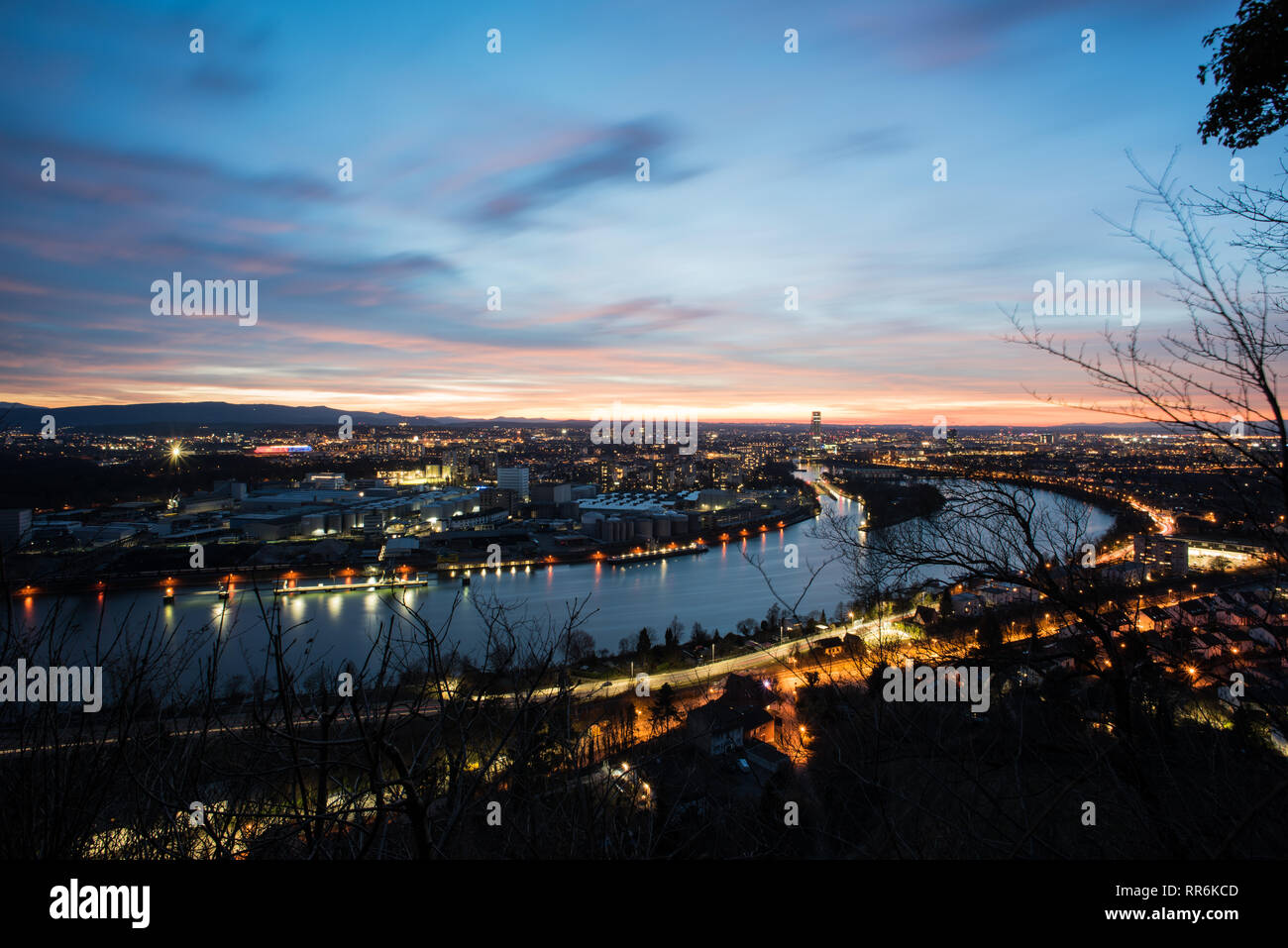 Basel Switzerland in the evening with a beautiful sunset, photographed by the Hornfelsen in neighboring Germany Stock Photo