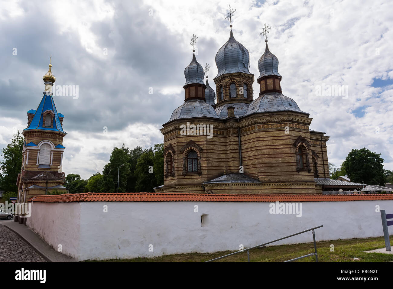 Jekabpils Orthodox Church of The Holy Spirit against cloudy sky. The church was built in the second part of the 19th century in Byzantine style. Its f Stock Photo