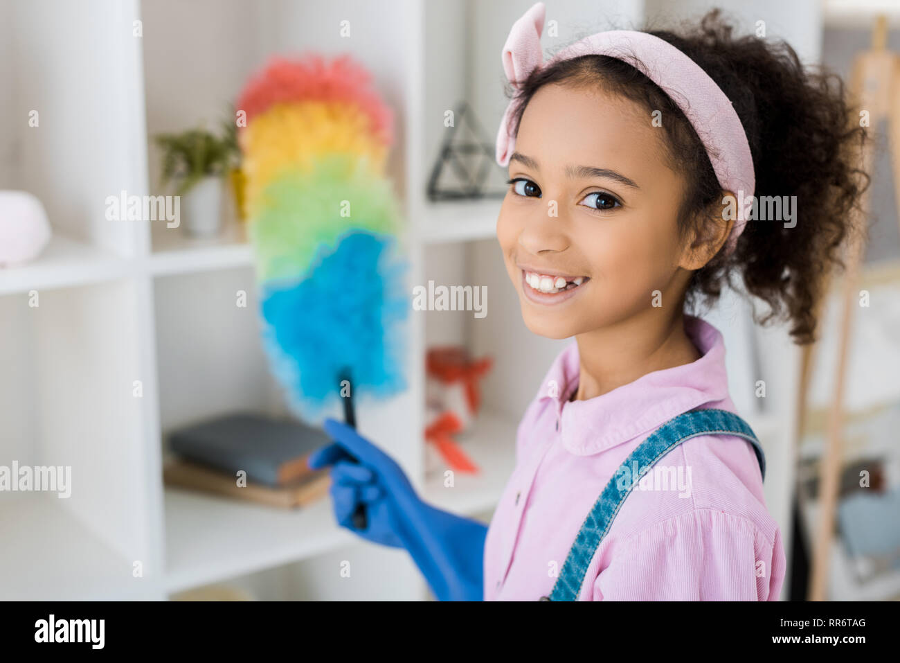 Selective Focus Of African American Child With Multicolored Duster