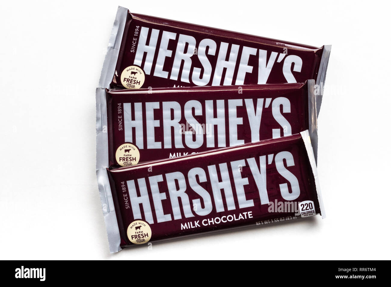 ST. PAUL, MN/USA - FEBRUARY 21, 2019: Grouping of three Hershey's Milk Chocolate candy bars and trademark logo. Stock Photo