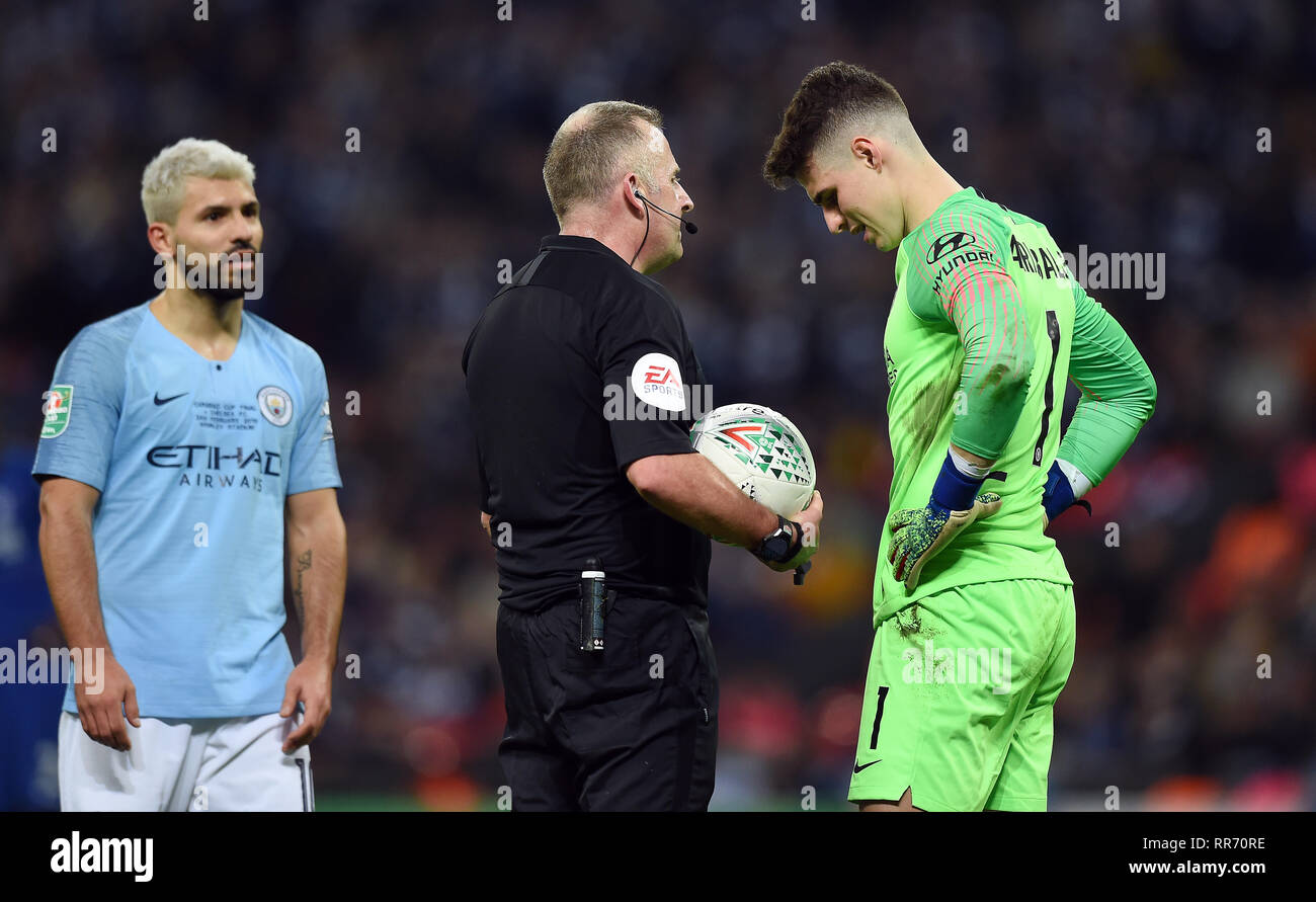 Referee jon moss talks with chelsea goalkeeper kepa arrizabalaga hires