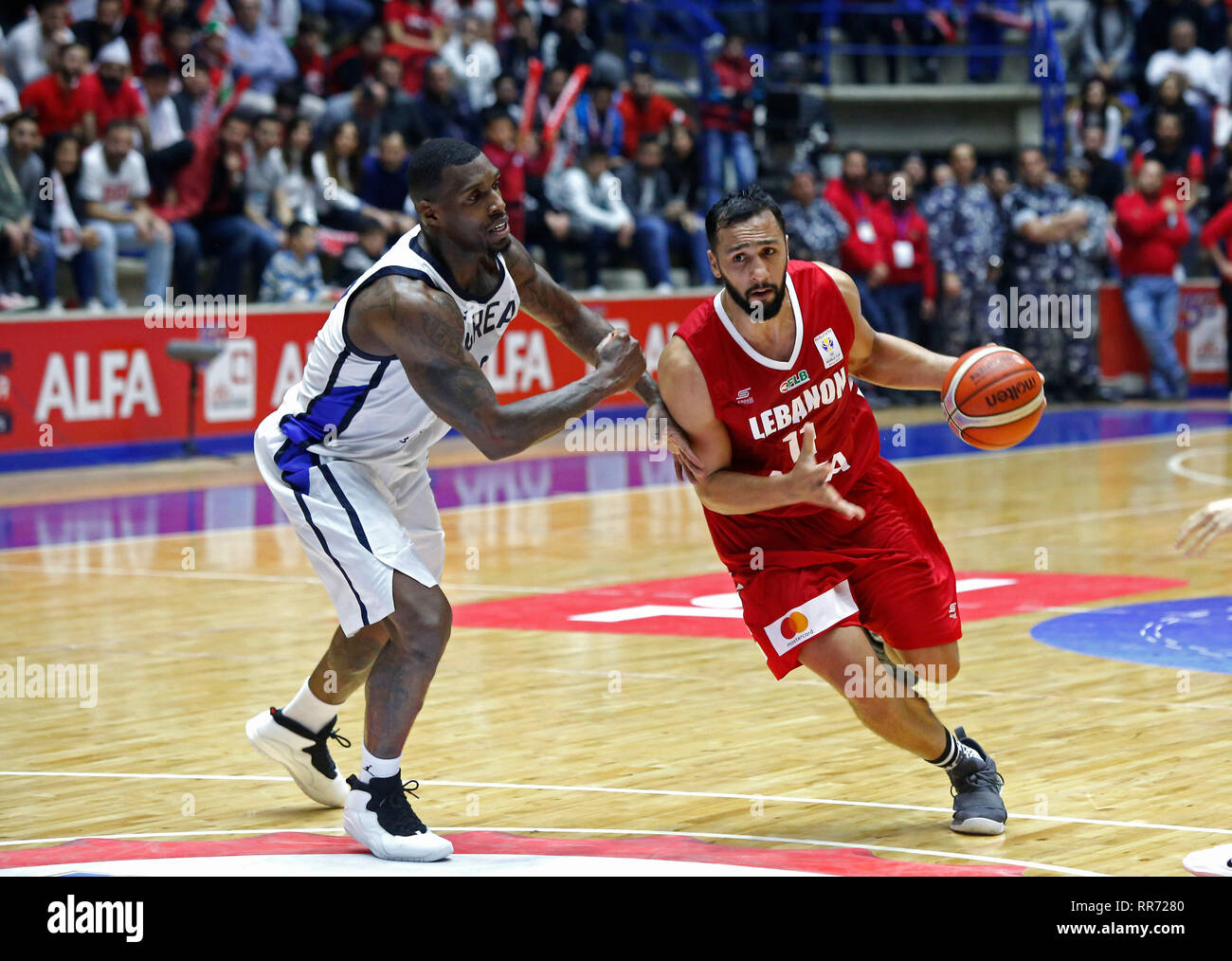 Zouk Mikael, Lebanon. 24th Feb, 2019. Ali Haidar (R) of Lebanon competes  during the FIBA Basketball World Cup 2019 Asian Qualifiers match between  Lebanon and South Korea in Zouk Mikael, Lebanon, Feb.