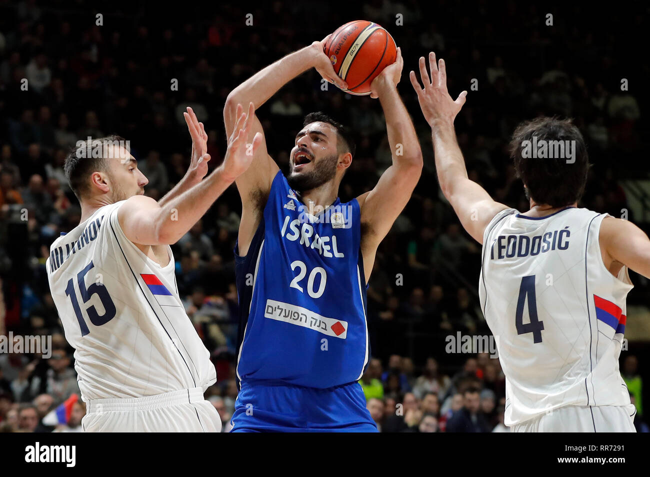 Belgrade, Serbia. 24th Feb, 2019. Israel's Idan Zalmanson (C) vies with  Serbia's Nikola Milutinov (L) and Milos Teodosic during FIBA World Cup  group L basketball qualifying match between Serbia and Israel in