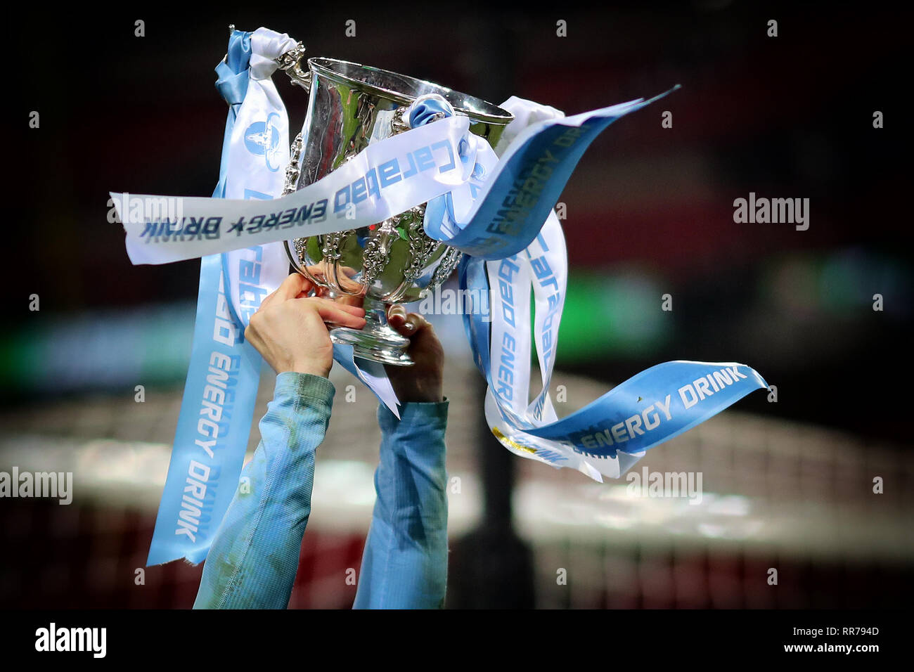 London, UK. 24th Feb, 2019. The League Cup Trophy held aloft in the colours of Manchester City - Chelsea v Manchester City, Carabao Cup Final, Wembley Stadium, London (Wembley) - 24th February 2019 Editorial Use Only - DataCo restrictions apply Credit: MatchDay Images Limited/Alamy Live News Stock Photo