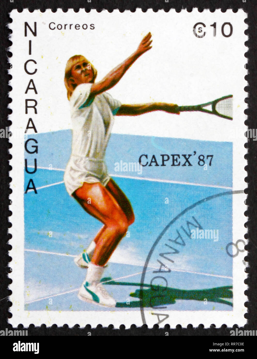 NICARAGUA - CIRCA 1987: a stamp printed in Nicaragua shows Female Tennis Player in Action, circa 1987 Stock Photo