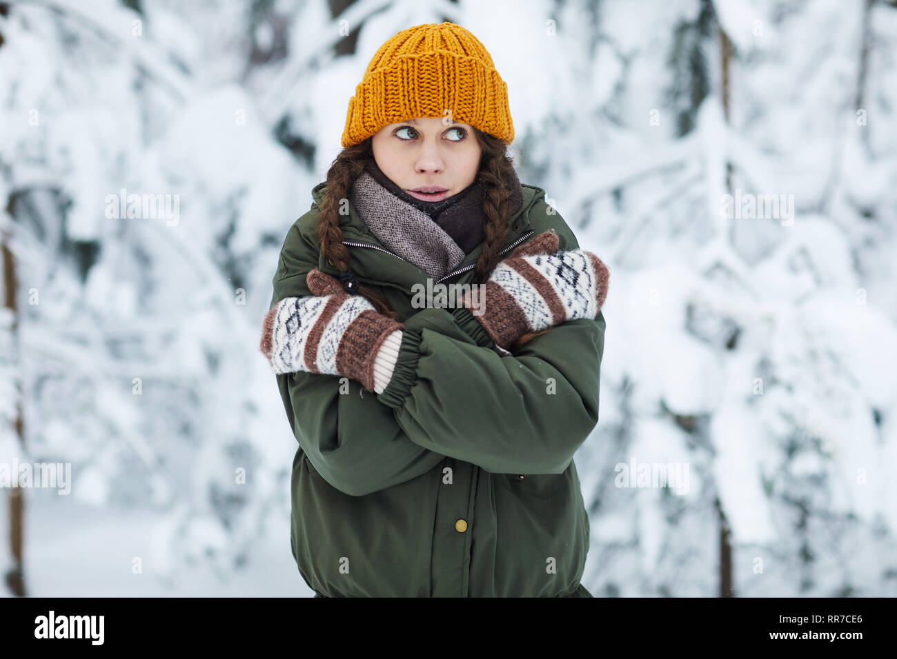 Young Woman Freezing in Winter Stock Photo