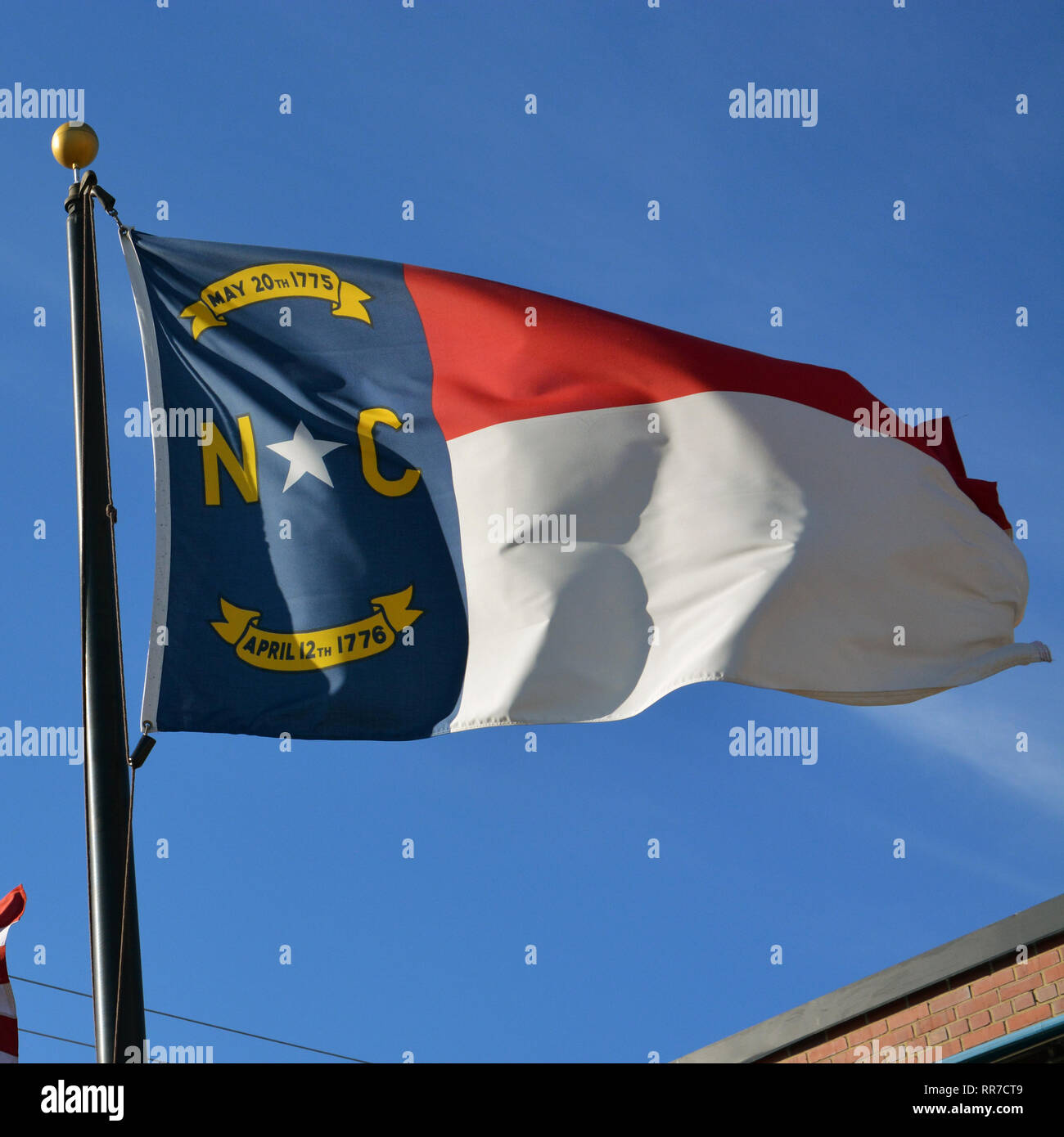 Flag of the state of North Carolina flapping in the wind. Stock Photo