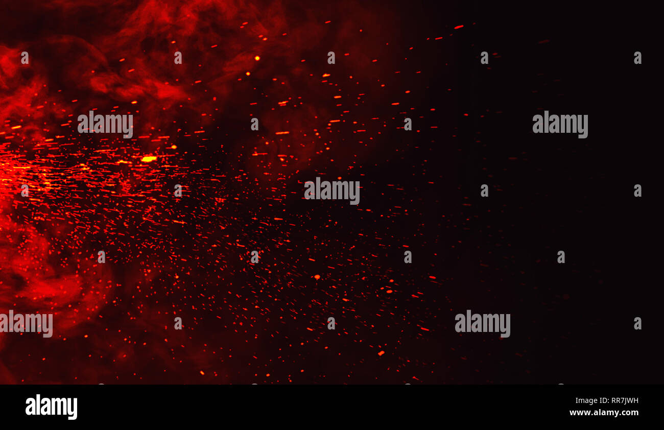 Fire particles debris isolated on black background for text or space . Film texture effect. Stock Photo