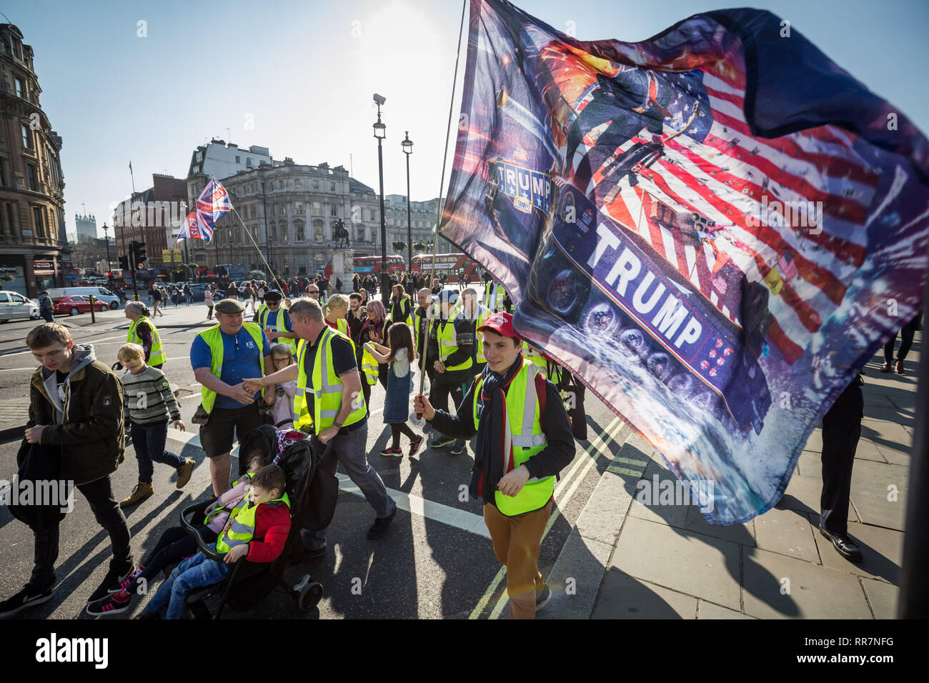 Pro-Brexit protesters calling themselves the 'Yellow Vests UK' movement block roads and traffic whilst protest marching through Westminster, London. Stock Photo