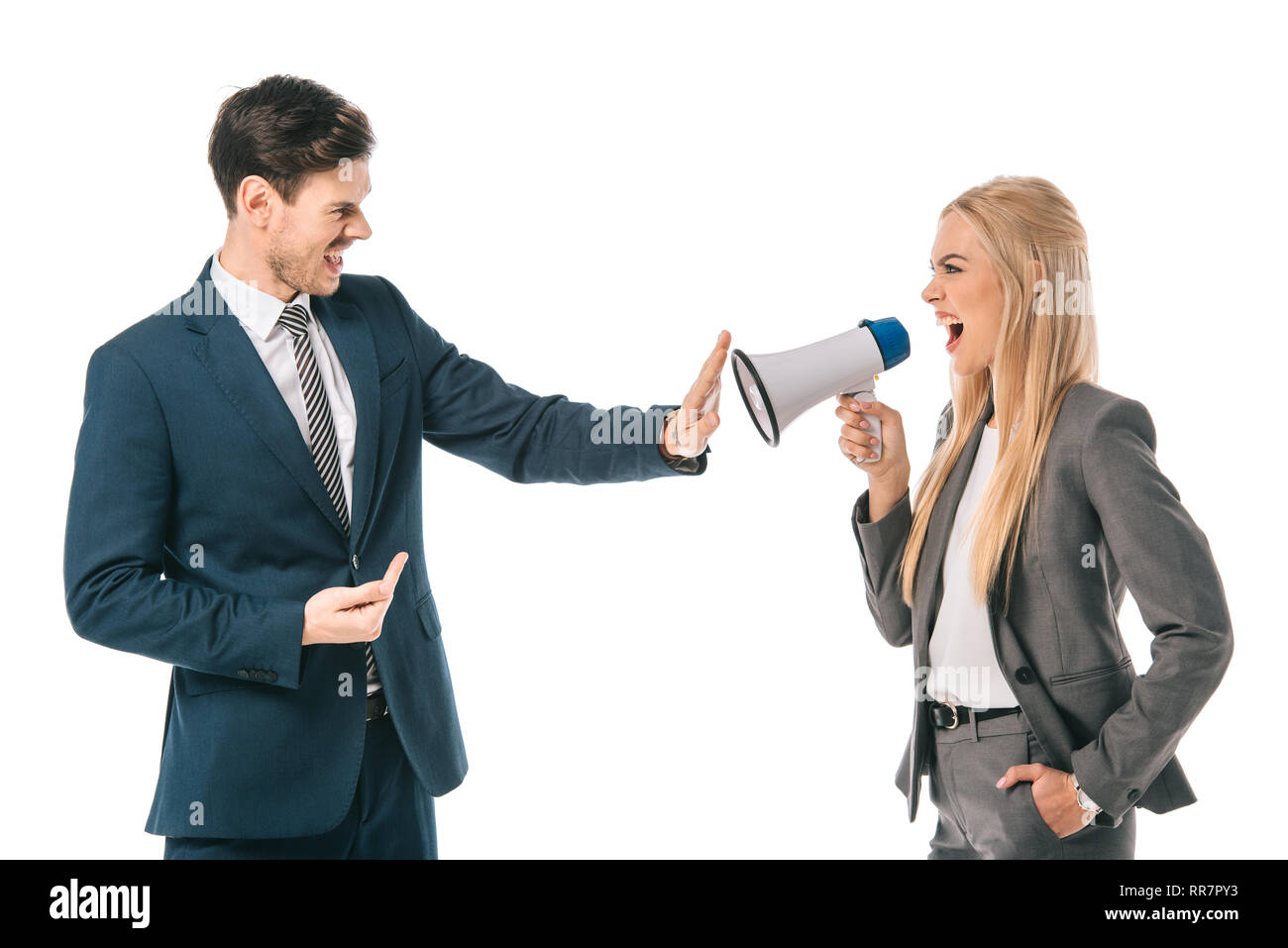 female boss shouting into megaphone at male employee who showing stop gesture isolated on white, gender equality concept Stock Photo