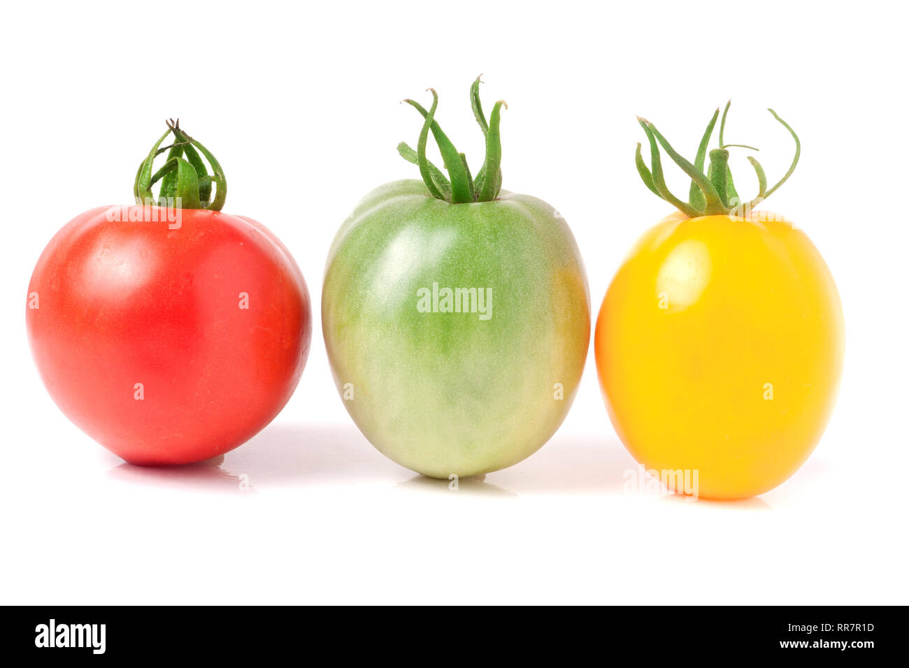 red yellow and green tomatoes isolated on white background Stock Photo ...