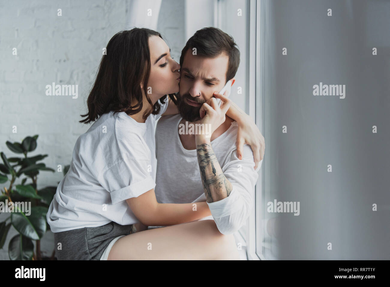 Beautiful woman kissing man hi-res stock photography and images - Alamy